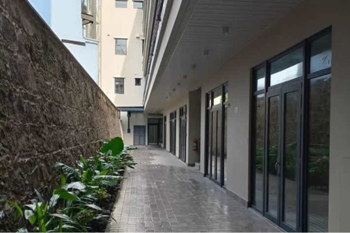 Glass door shop fronts along walkway La Plazuela Casco Viejo