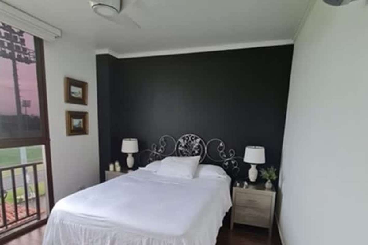 Bright living room with balcony access at PH Greenview Costa Sur Panama City