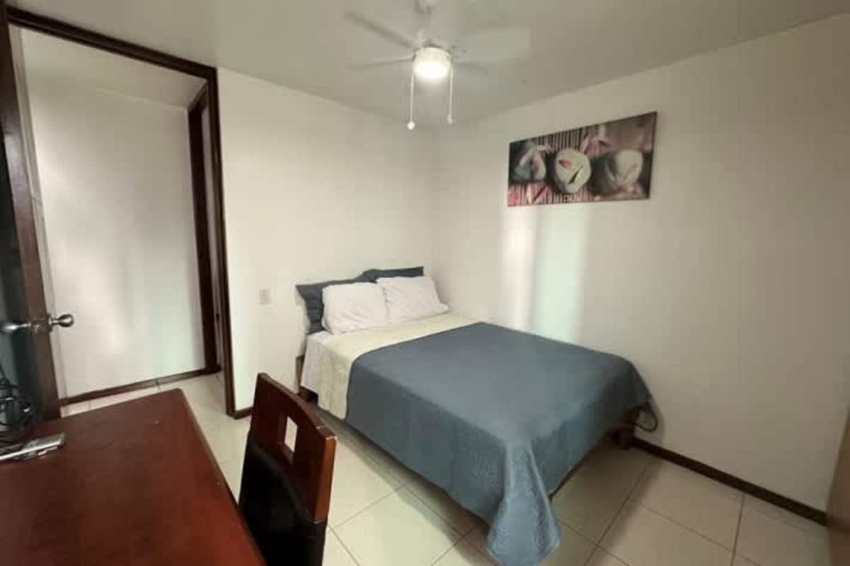 Contemporary kitchen with granite countertops and full appliances at Pacific Point Punta Pacifica Panama