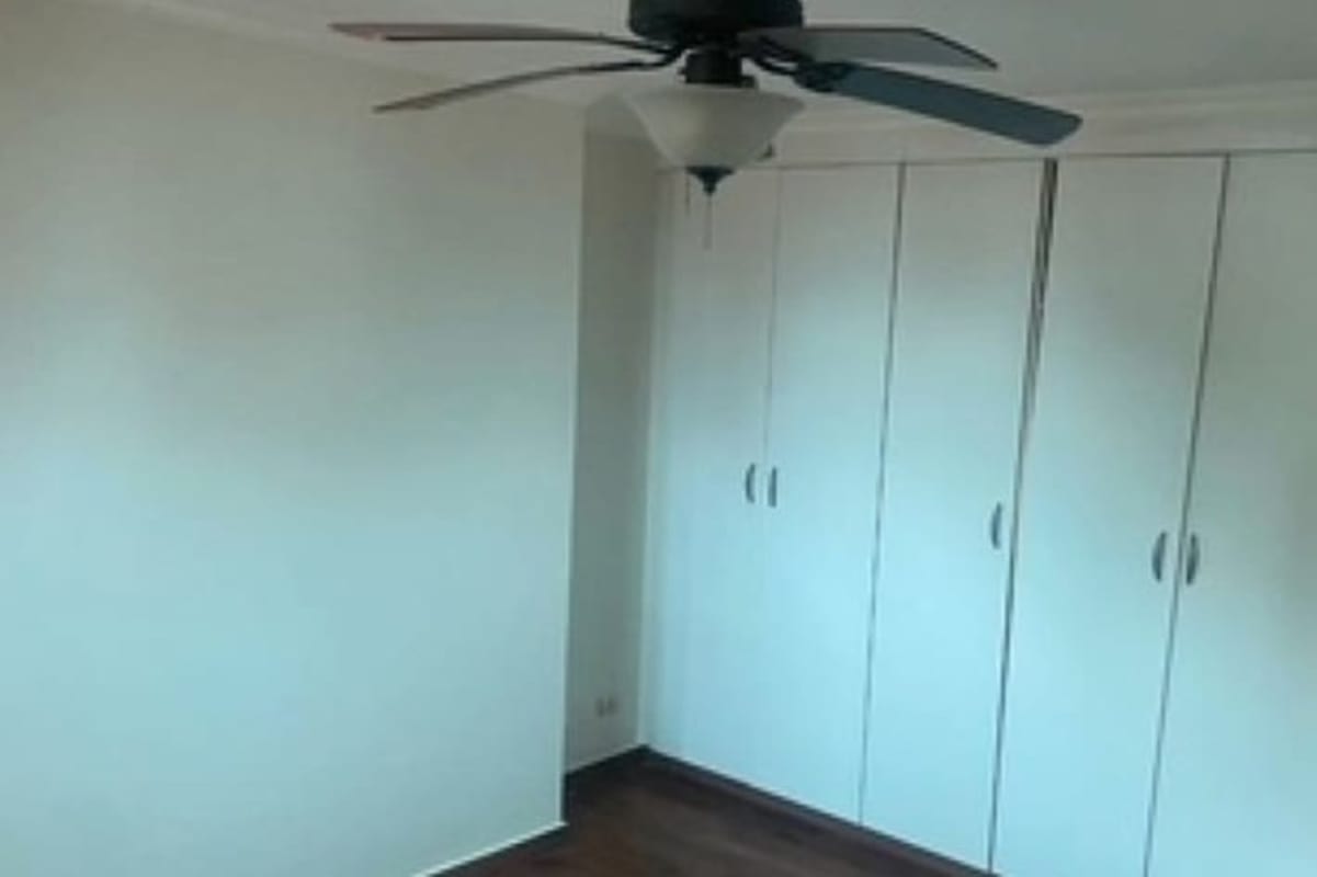Bedroom with built-in wardrobe, ceiling fan, wood flooring PH Altavista Hato Pintado