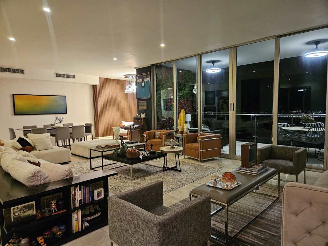 Elegant living and dining area with marble floors and city ocean views PH Aqualina Panama