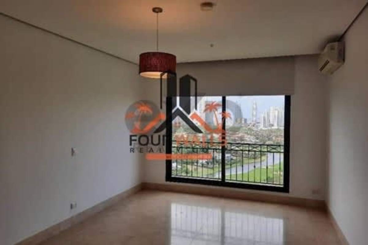 Luxury bathroom with freestanding tub and large window overlooking golf and city in PH La Vista Santa Maria Panama