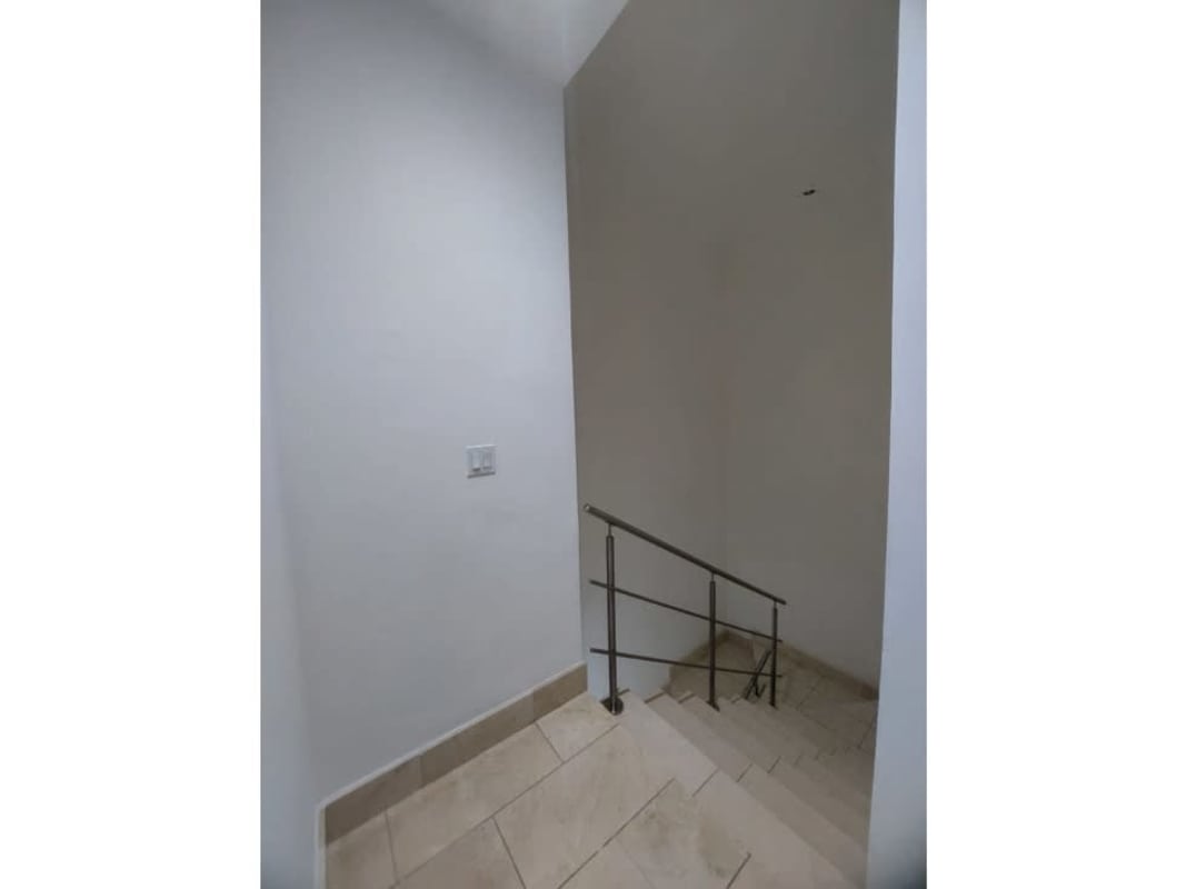 Modern loft interior with double-height ceiling in Grand Tower luxury condo Panama City