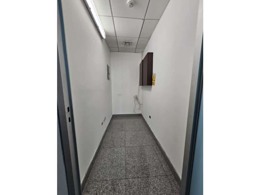 Narrow utility storage room with granite floors in commercial office at PH Global Bank Panama City