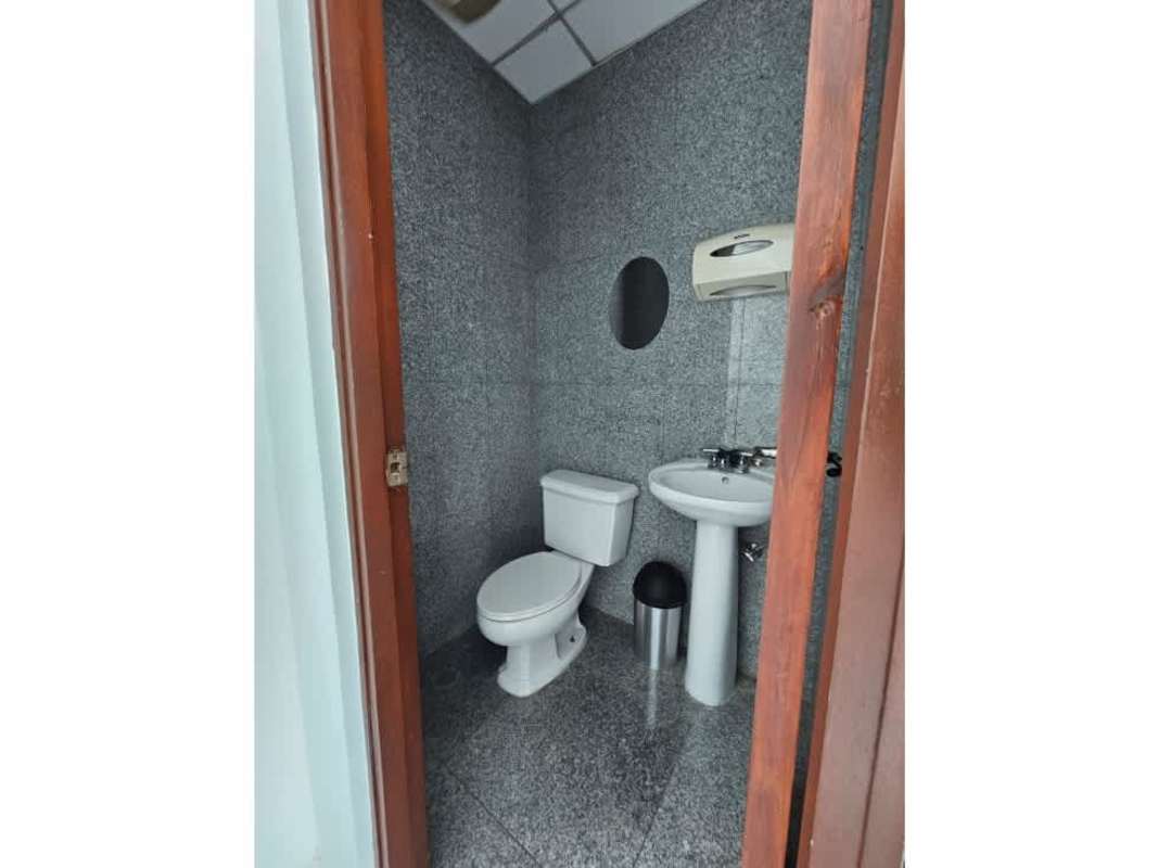 Compact bathroom with granite finish, pedestal sink, round mirror PH Global Bank Tower Panama City
