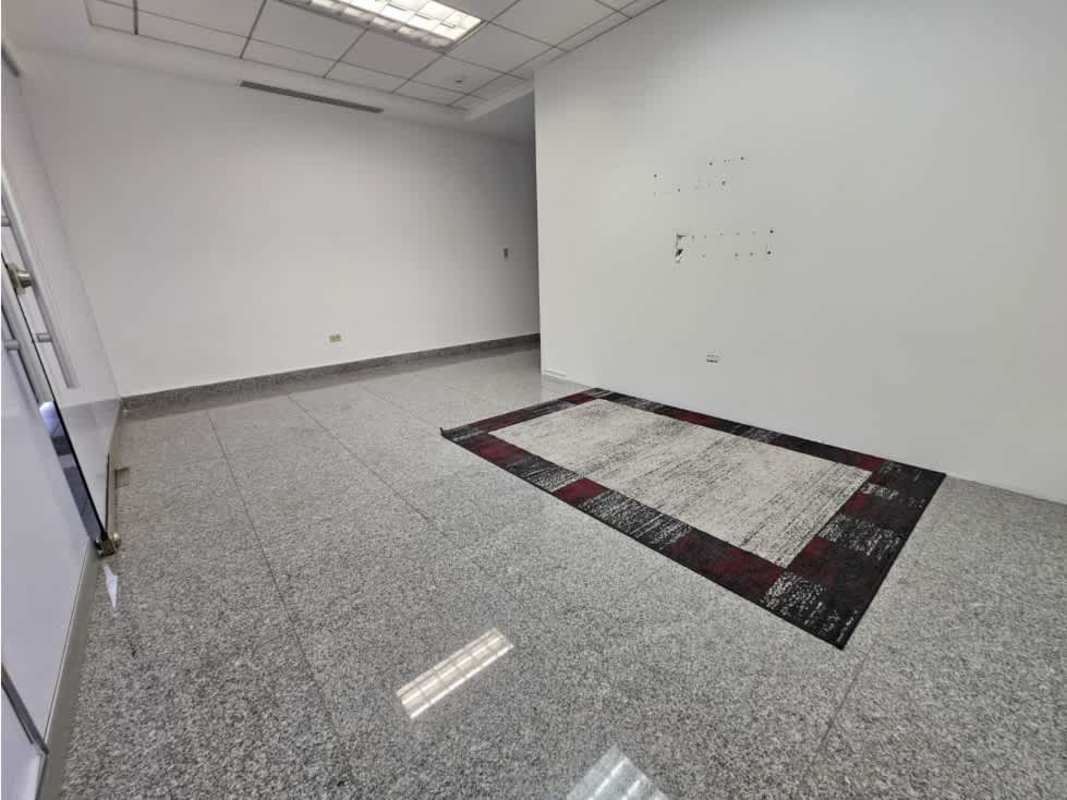 Empty commercial office space with tiled granite floors, fluorescent lighting PH Global Bank Panama