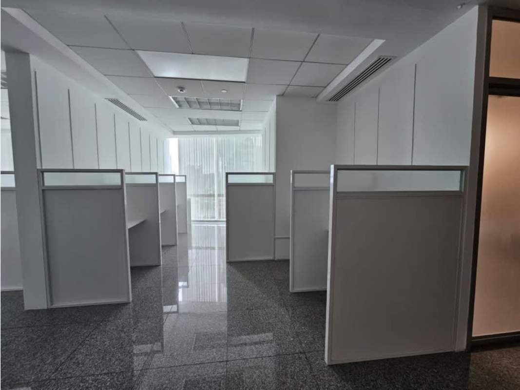 Bright office with cubicles, glass partitions and city views PH Global Bank Panama City