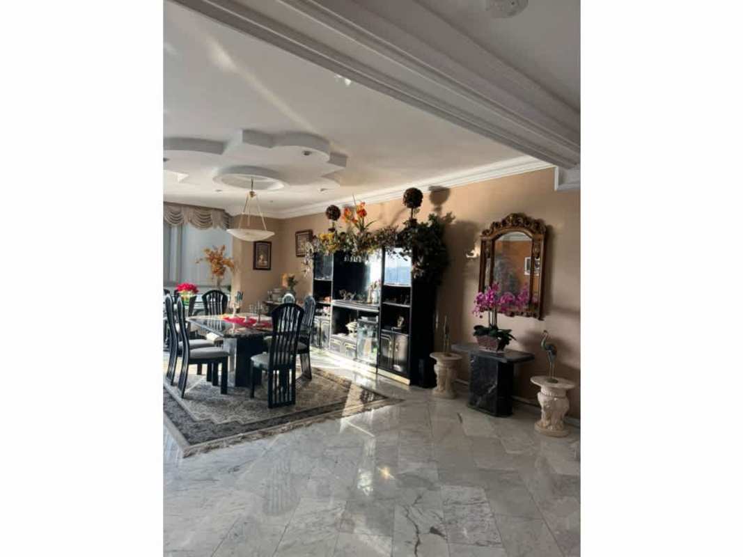 Luxurious living room with marble floors and ocean view windows in PH Villa Marina Punta Paitilla