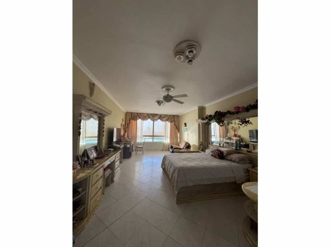 Dining space with ocean view windows marble floors chandelier PH Villa Marina Punta Paitilla