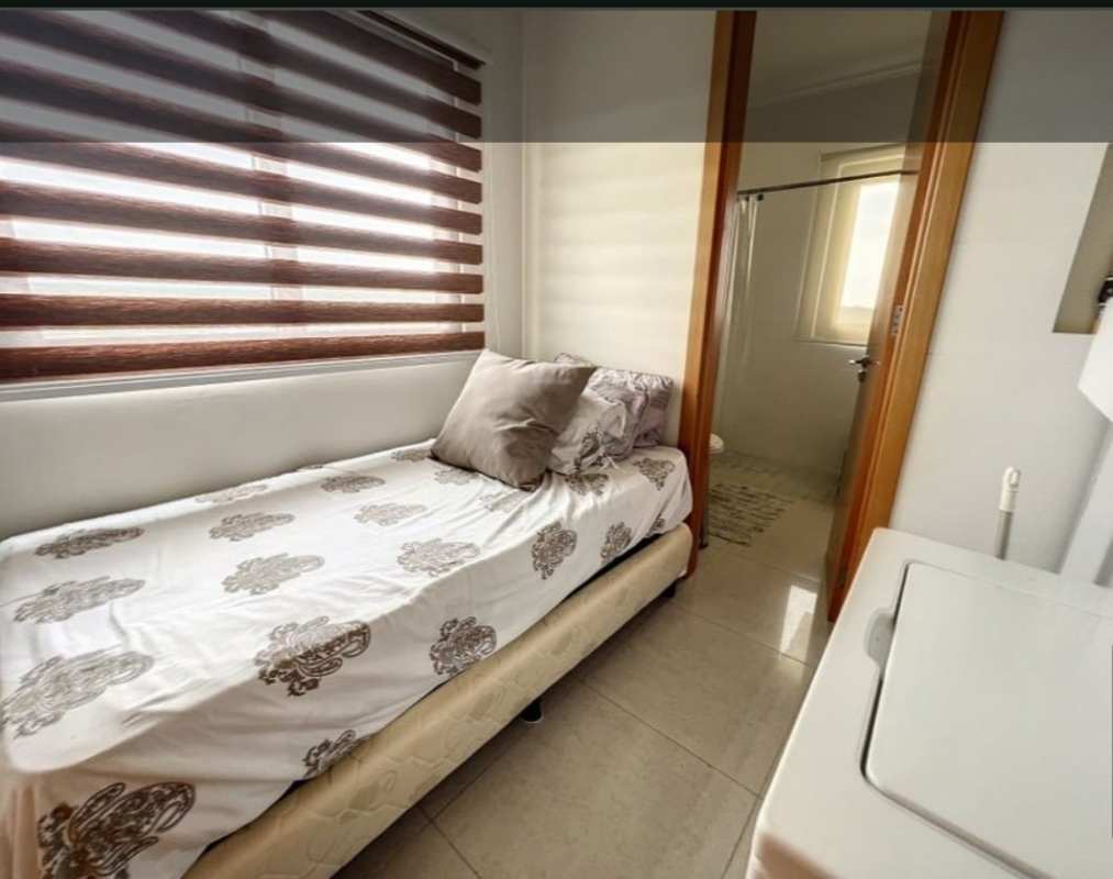 Contemporary bathroom with marble counters, double sink and wood accents PH Perlamar Casamar San Francisco Panama