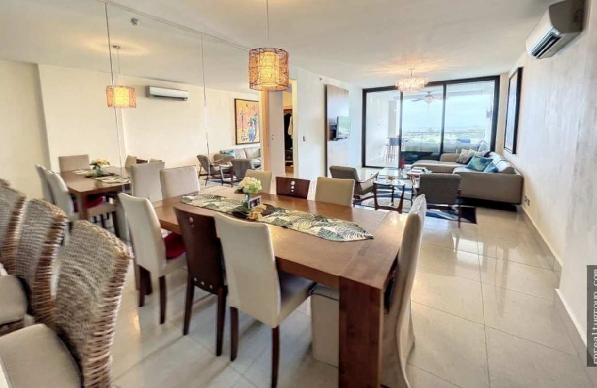 Main bedroom with large window, seating area and modern decor PH Perlamar Casamar San Francisco Panama