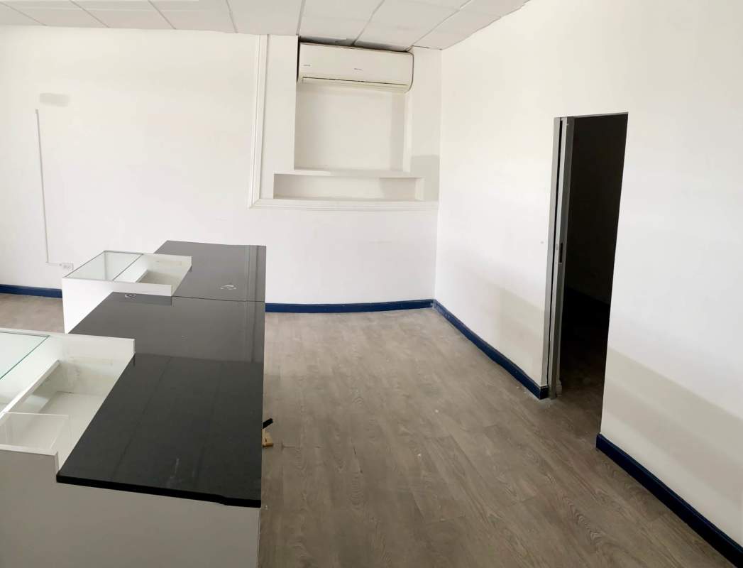 Reception counter with glass partitions inside commercial space in Costa del Este Panama