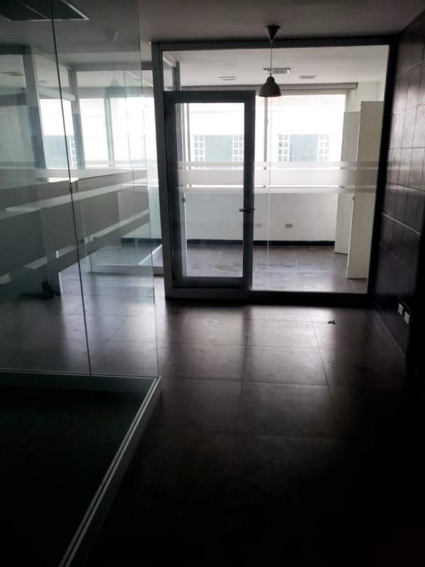 Modern commercial office with glass rooms bright lighting PH Camino de Cruces Panama