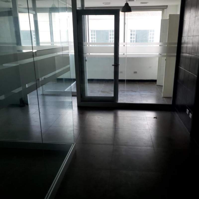 Glass wall modern bright office space in PH Camino de Cruces commercial tower Panama City