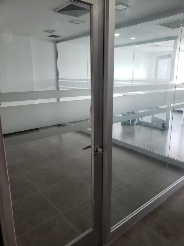 Private cubicle style office with glass partition inside commercial tower Camino de Cruces Panama