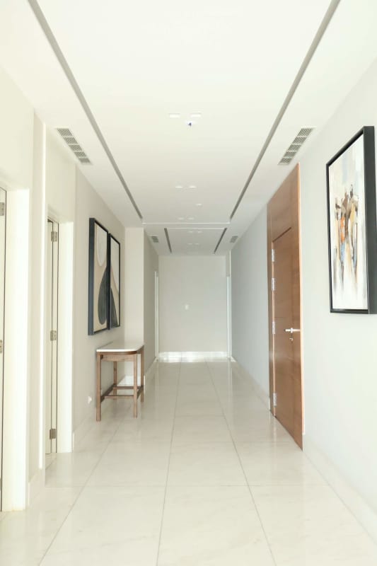 Modern gym with cardio and weights overlooking Pacific Ocean at PH The Residences Punta Pacífica