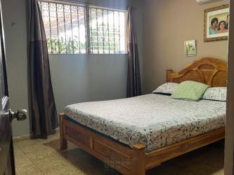 Covered terrace and garden patio with gazebo at corner house in Residencial Las Perlas Arraiján Panama