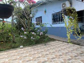 Kitchen with wooden cabinets, double sink, stainless appliances at Arraiján Panama house