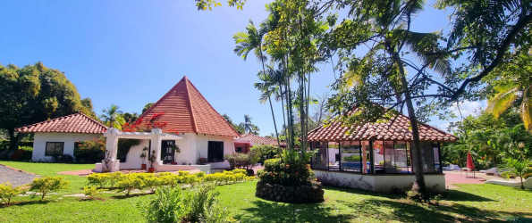 Beach villa by Malibu Beach Panama with pool, tropical landscaping, and tiled patio