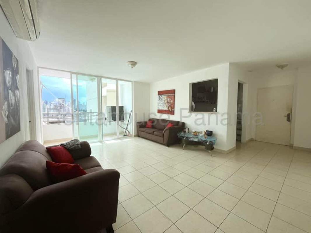 Living area with balcony access and natural light at Edison Park apartment Panama