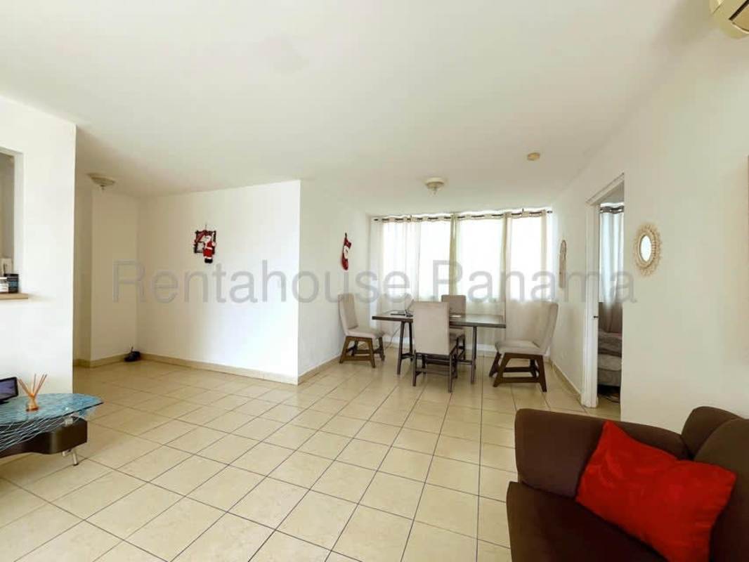 Spacious combined living dining area with bright windows in Panama City apartment