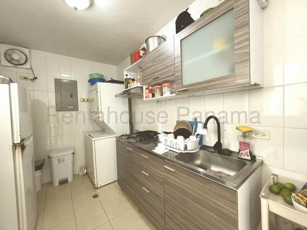 Bright apartment bedroom with window, closet and tile flooring in Panama City