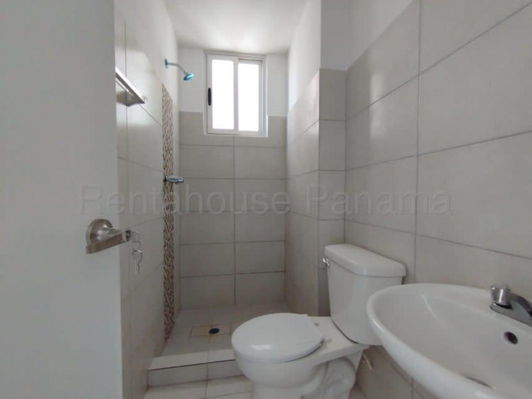 Bedroom with white closet and tile flooring in apartment PH Mystic Valley El Crisol