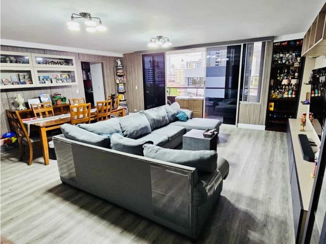 Updated kitchen with wooden cabinetry granite countertops and retro wall décor PH Del Rey El Cangrejo Panama City