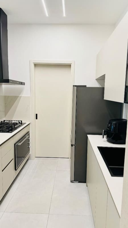 Bright living dining area with large windows and ocean view in PH The Palace Punta Paitilla Panama City