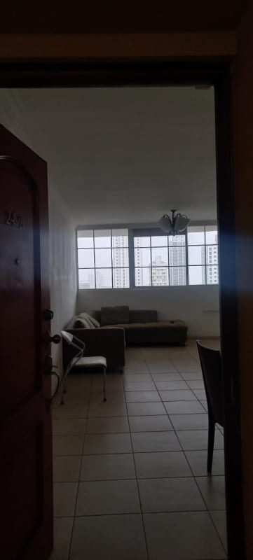 Kitchen with tiled backsplash, open shelving, gas stove and dining area in PH Torre Mar del Sur Panama City