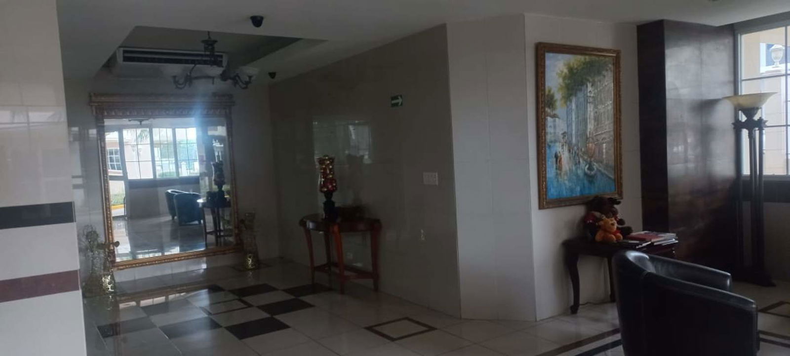 Apartment living room with tiled flooring, big windows and skyline views in PH Torre Mar del Sur Panama City