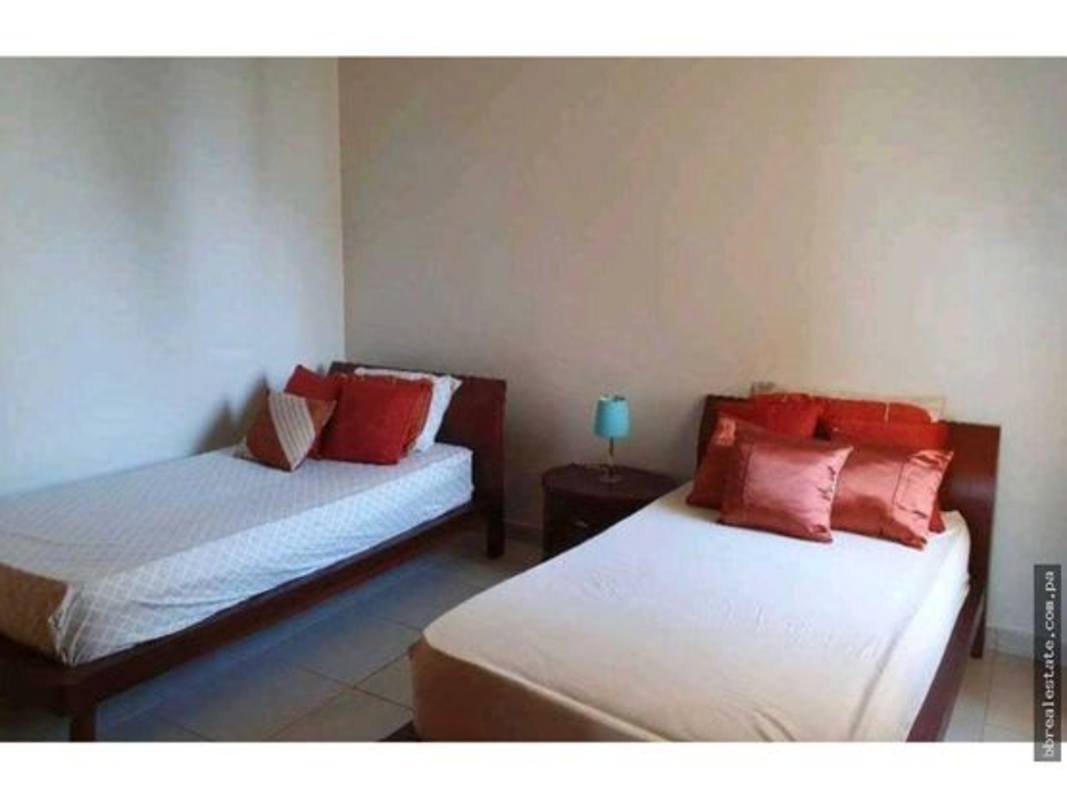 Bedroom featuring two beds, neutral decor, tiled floors in PH Costa Pacifica Punta Pacifica Panama for rent