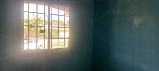 Walled backyard green grass privacy in Penonomé affordable house