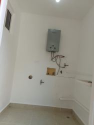 Laundry area utility room with water heater space and utility sink in villa Chame Panama