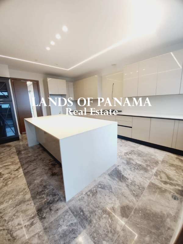 Spacious master bedroom with large window overlooking golf course Empire Residences Panama