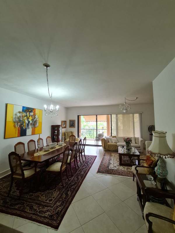 Traditional open concept living dining room with chandeliers, balcony Embassy Club Clayton