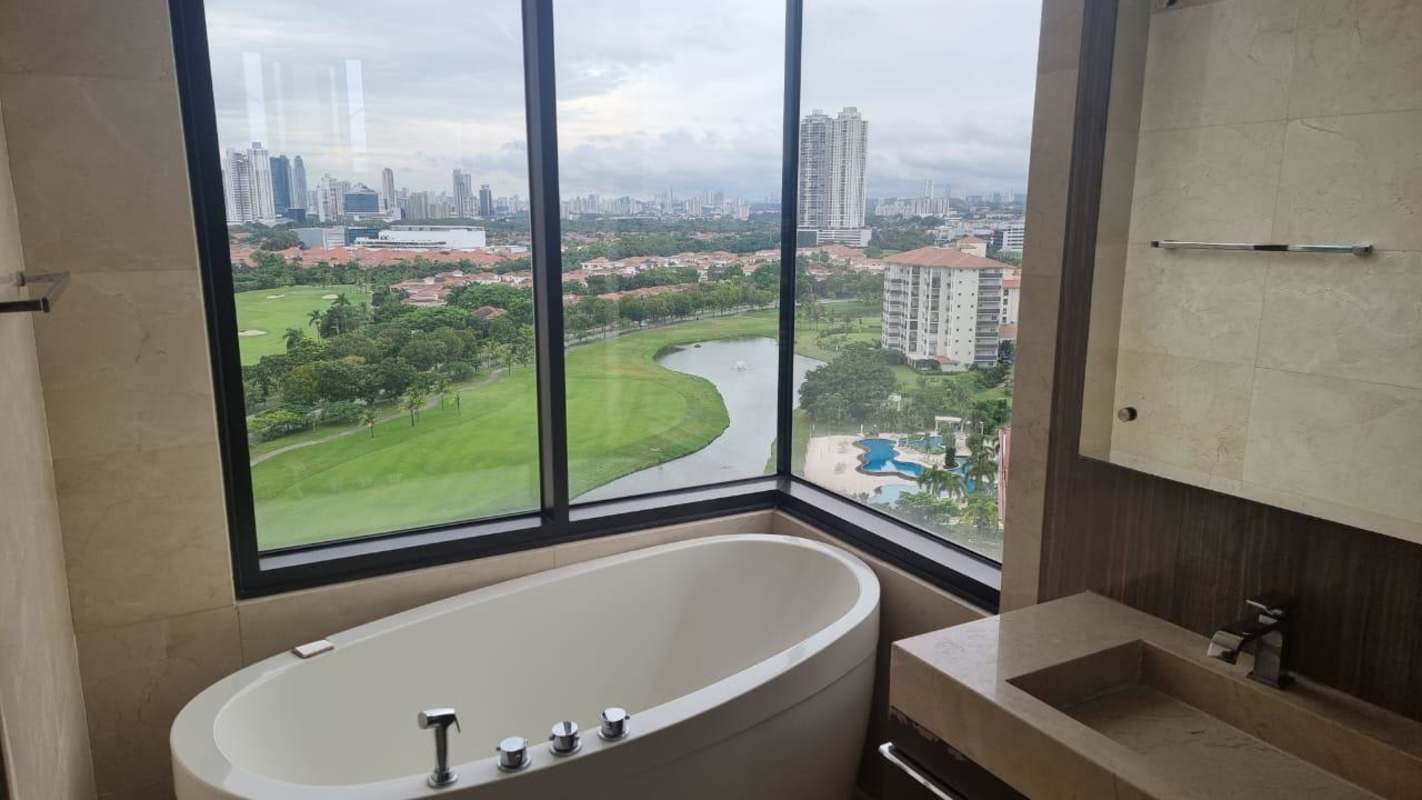 Modern bathroom featuring freestanding bathtub, large windows with panoramic skyline and golf views at La Vista Santa María