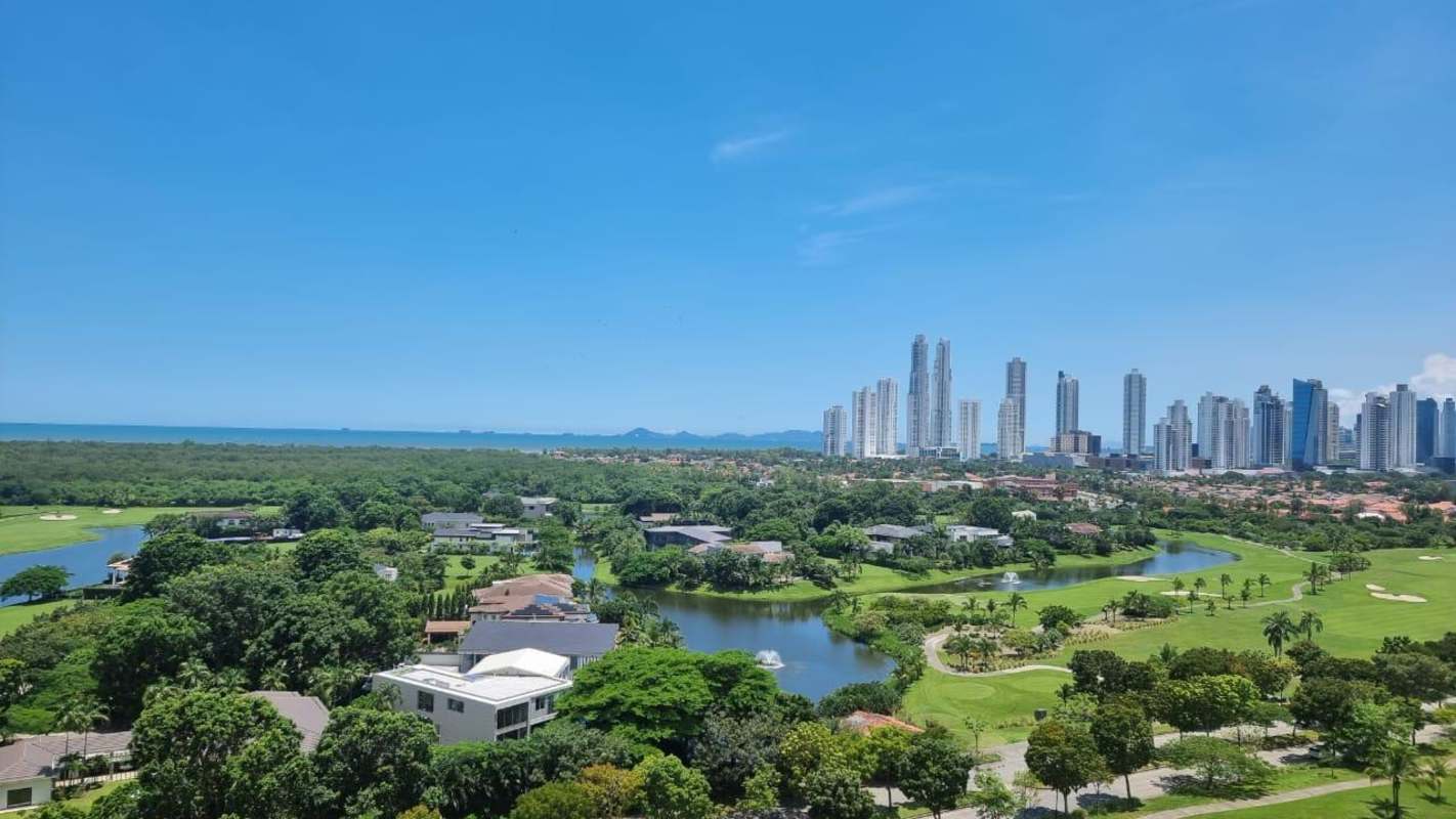 Panoramic aerial of Santa María community with golf course, ocean view, skyline and luxury residences