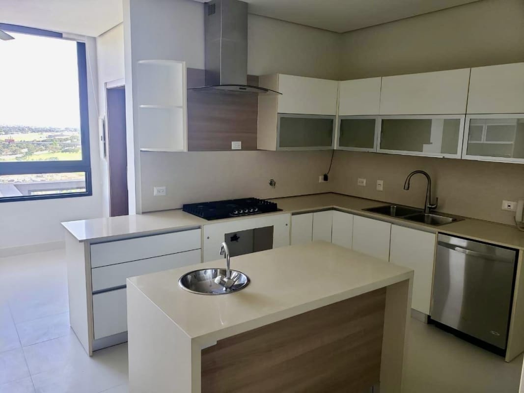Modern kitchen with island, stainless steel appliances, panoramic window in La Vista Santa María Panama