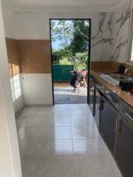 Kitchen ceramic tiles marble accent wall door to garden Panama rental