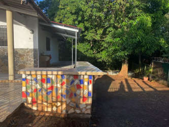 Backyard patio with mosaic counter shaded yard Vacamonte residential rental