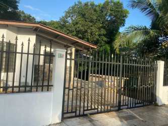 Suburban house with gate large trees and driveway Panama rental
