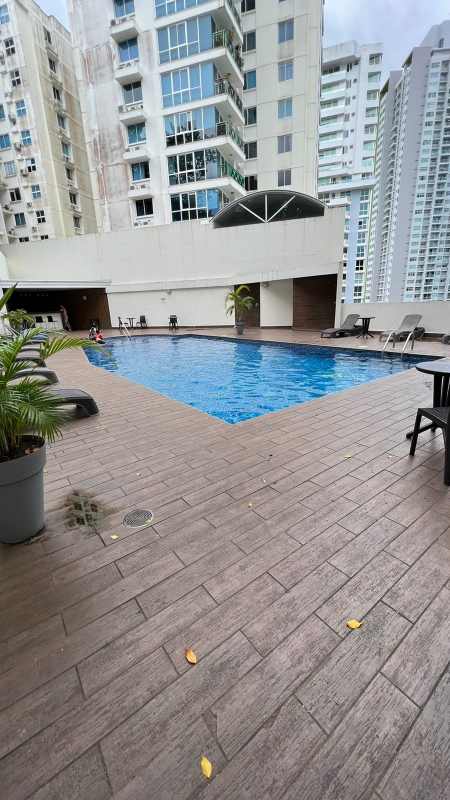 Outdoor residents pool area in PH Belview Edison Park with sun loungers and modern apartment towers