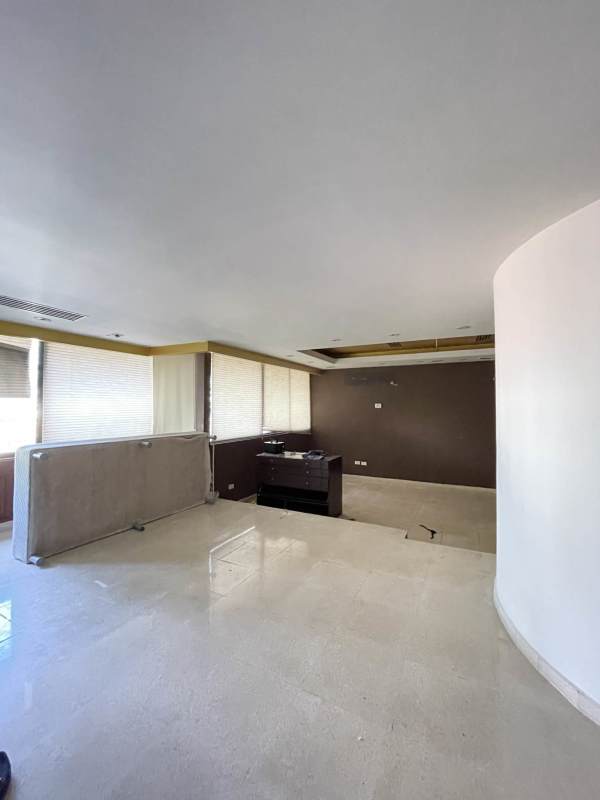 Large windows and neutral decor in modern room Punta Paitilla house sale