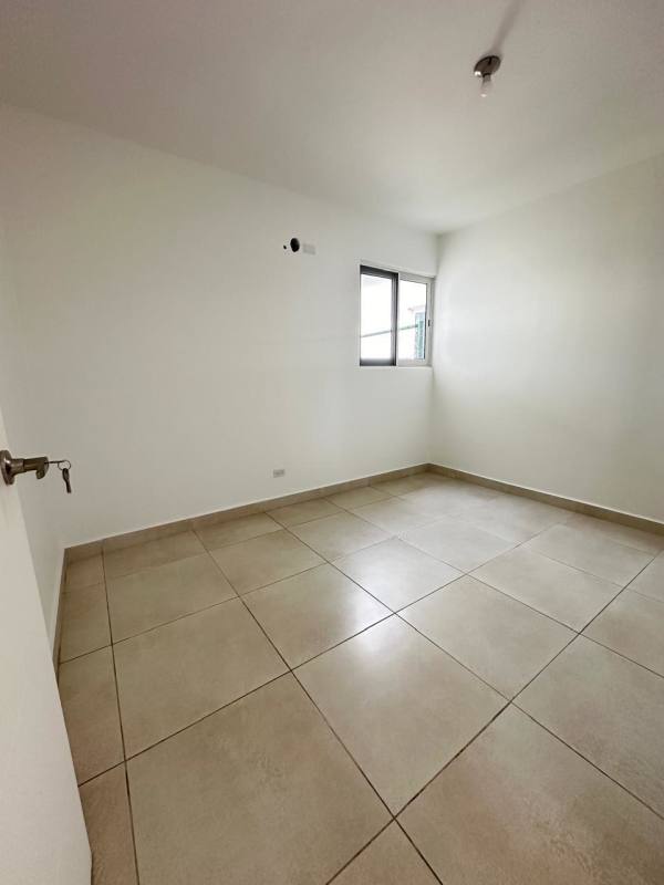 Bright open living area with sliding glass doors to backyard terrace in Villa Sur Costa Sur Panama City