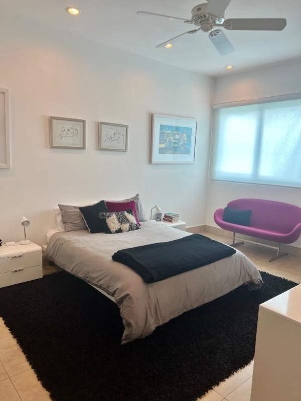 Luxury bedroom with floor-to-ceiling glass and ocean views in Ten Tower Panama