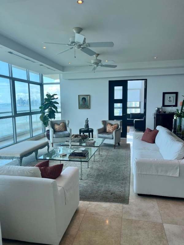 Spacious kitchen with granite countertops and island seating in PH Ten Tower Costa del Este