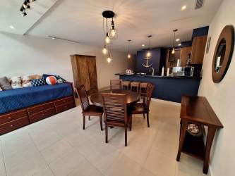 Kitchenette equipped with appliances, granite countertops inside loft suite The Bristol Residences Buenaventura Panama