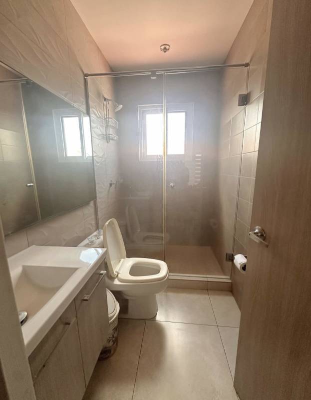 Kitchen with granite countertops, stove, fridge, modern cabinets in luxury house Costa Sur Panama