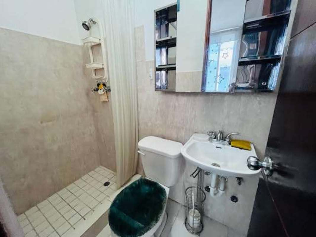 Open plan living dining area with balcony access at PH Bella Vista Park Panama